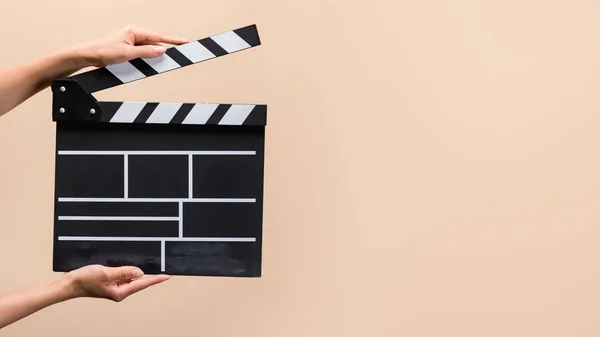 Partial View Woman Holding Clapper Board Hands Isolated Beige — стоковое фото